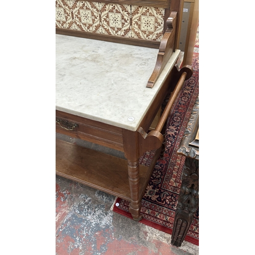 177 - An Edwardian walnut and marble top washstand with ceramic tile splashback - approx. 121cm high x 120... 