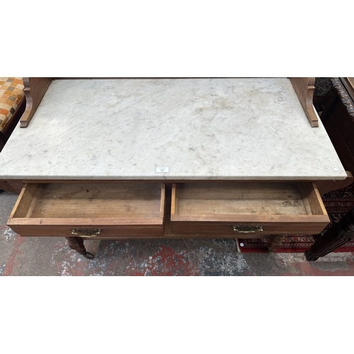 177 - An Edwardian walnut and marble top washstand with ceramic tile splashback - approx. 121cm high x 120... 