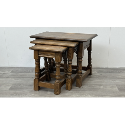 178 - A Wood Bros 'Old Charm' oak joint nest of three tables - approx. 45cm high x 60cm wide x 32cm deep