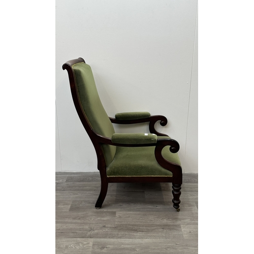 180 - A 19th century rosewood and green fabric upholstered scrolled armchair on brass castors - approx. 11... 