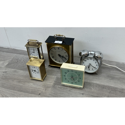 189 - Five various clocks, one Minster brass cased quartz mantel, one Westclox mains electric alarm, one c... 