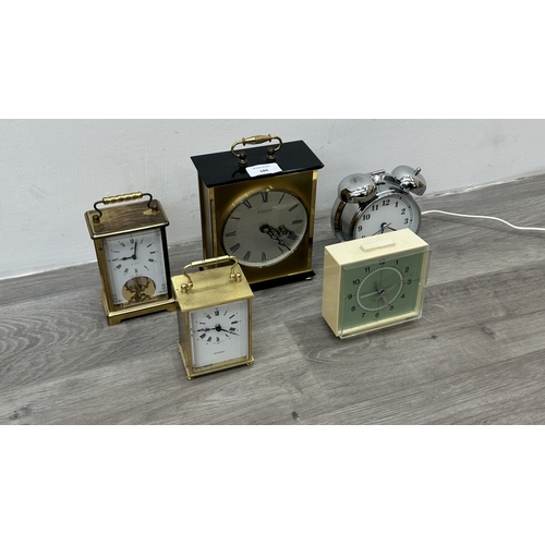 189 - Five various clocks, one Minster brass cased quartz mantel, one Westclox mains electric alarm, one c... 