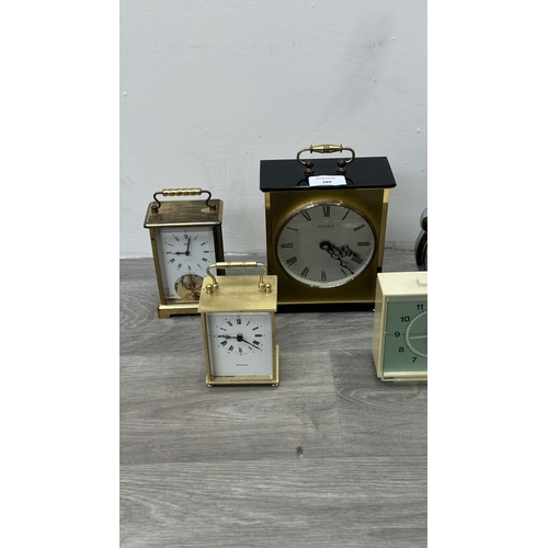 189 - Five various clocks, one Minster brass cased quartz mantel, one Westclox mains electric alarm, one c... 