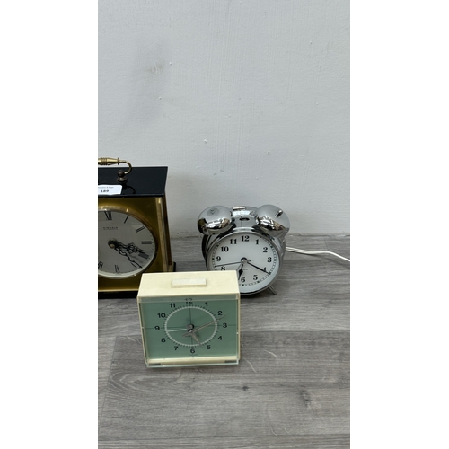 189 - Five various clocks, one Minster brass cased quartz mantel, one Westclox mains electric alarm, one c... 