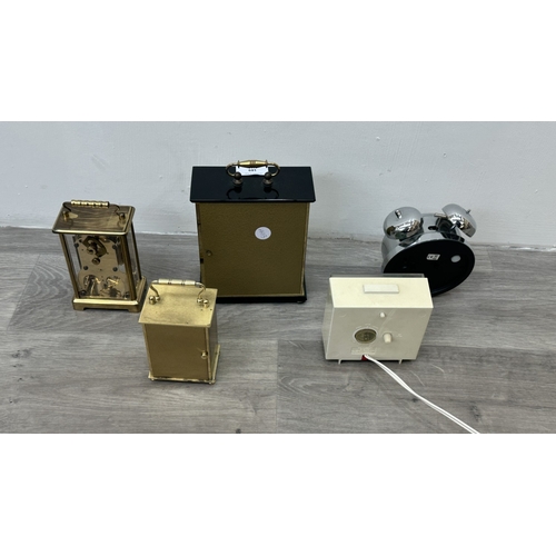189 - Five various clocks, one Minster brass cased quartz mantel, one Westclox mains electric alarm, one c... 
