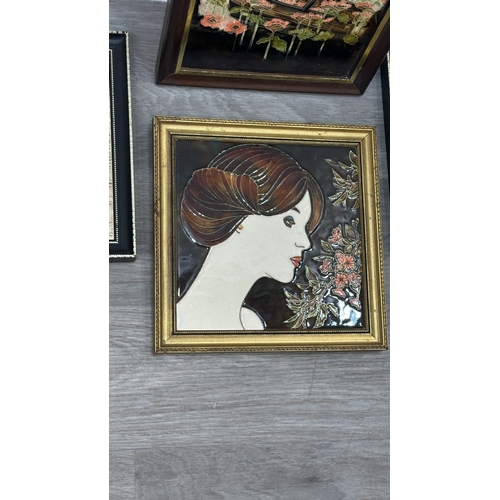 194 - Four framed hand painted ceramic tubelined tile wall plaques, two Maw & Co. Art Nouveau style, one A... 