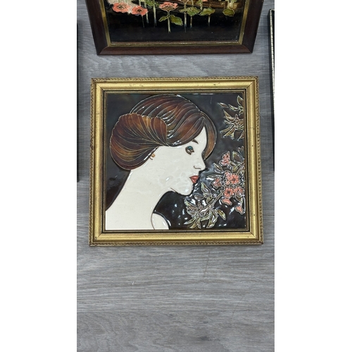 194 - Four framed hand painted ceramic tubelined tile wall plaques, two Maw & Co. Art Nouveau style, one A... 