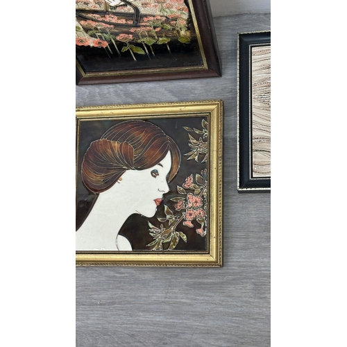 194 - Four framed hand painted ceramic tubelined tile wall plaques, two Maw & Co. Art Nouveau style, one A... 