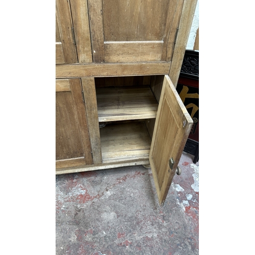 197 - A 19th century stripped hardwood housekeeper's cupboard - approx. 213cm high x 140cm wide x 47cm dee... 