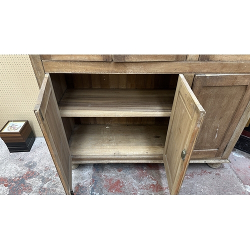 197 - A 19th century stripped hardwood housekeeper's cupboard - approx. 213cm high x 140cm wide x 47cm dee... 