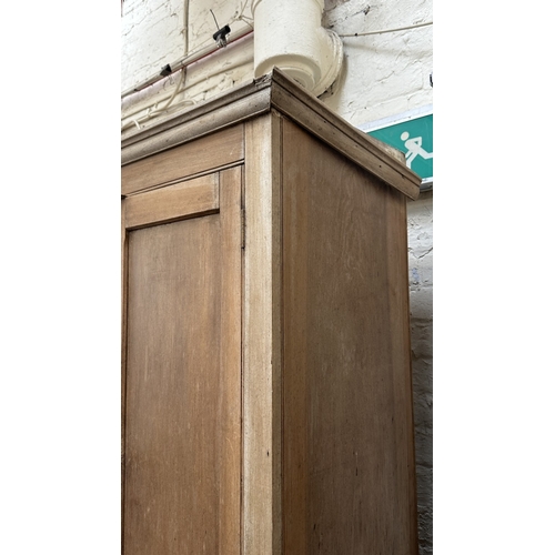197 - A 19th century stripped hardwood housekeeper's cupboard - approx. 213cm high x 140cm wide x 47cm dee... 