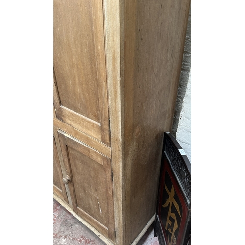 197 - A 19th century stripped hardwood housekeeper's cupboard - approx. 213cm high x 140cm wide x 47cm dee... 