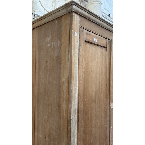 197 - A 19th century stripped hardwood housekeeper's cupboard - approx. 213cm high x 140cm wide x 47cm dee... 