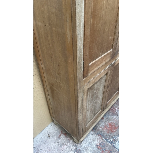 197 - A 19th century stripped hardwood housekeeper's cupboard - approx. 213cm high x 140cm wide x 47cm dee... 