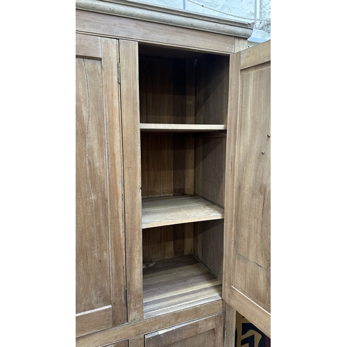 197 - A 19th century stripped hardwood housekeeper's cupboard - approx. 213cm high x 140cm wide x 47cm dee... 
