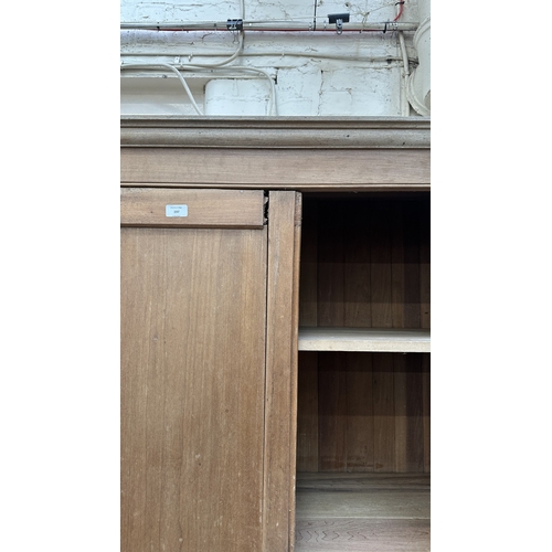 197 - A 19th century stripped hardwood housekeeper's cupboard - approx. 213cm high x 140cm wide x 47cm dee... 