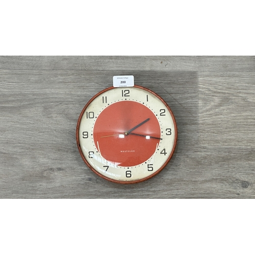 200 - A mid 20th century Westclox red metal cased circular wall clock - approx. 19cm diameter
