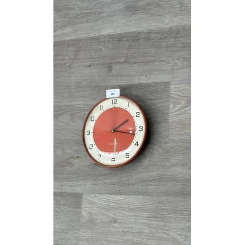 200 - A mid 20th century Westclox red metal cased circular wall clock - approx. 19cm diameter