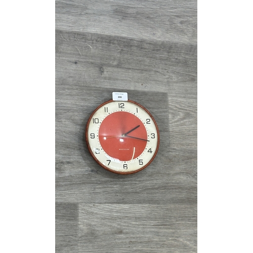 200 - A mid 20th century Westclox red metal cased circular wall clock - approx. 19cm diameter