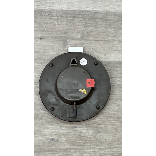 200 - A mid 20th century Westclox red metal cased circular wall clock - approx. 19cm diameter