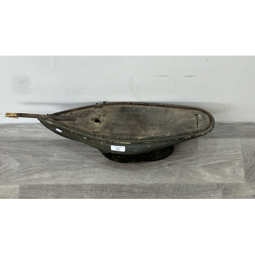 211 - An early 20th century green painted wooden pond yacht - approx. 21cm high x 16cm wide x 57cm long