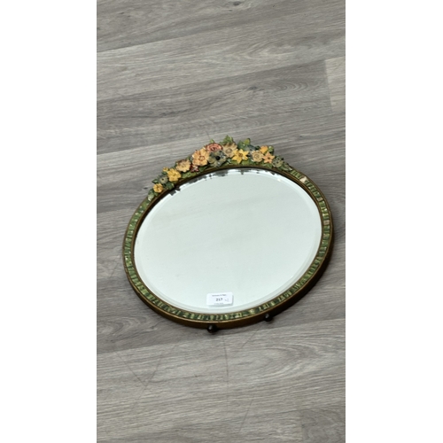 217 - Two early/mid 20th century Barbola hand painted floral decorated framed bevelled edge mirrors, one c... 