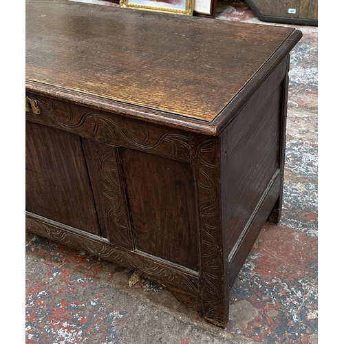 218 - An 18th century carved oak three panel coffer - approx. 62cm high x 113cm wide x 48cm deep