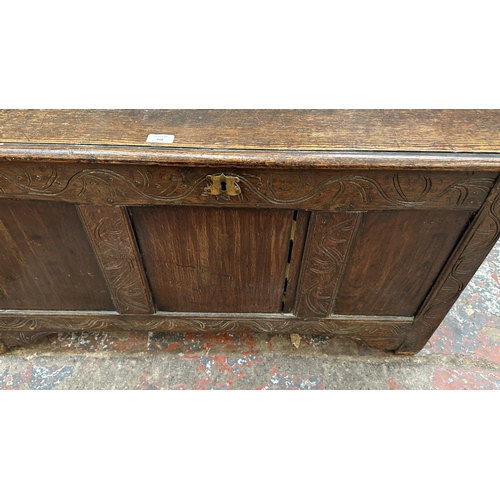218 - An 18th century carved oak three panel coffer - approx. 62cm high x 113cm wide x 48cm deep