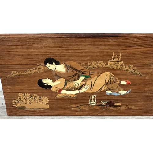 232 - An Indian marquetry inlaid hardwood wall plaque depicting couple - approx. 29.5cm high x 45cm wide