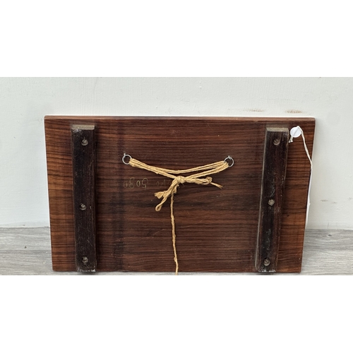 232 - An Indian marquetry inlaid hardwood wall plaque depicting couple - approx. 29.5cm high x 45cm wide