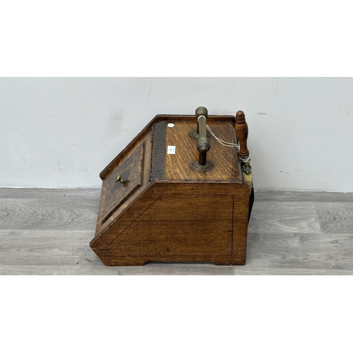 249 - A late 19th/early 20th century oak and walnut coal scuttle with brass handle and shovel - approx. 36... 