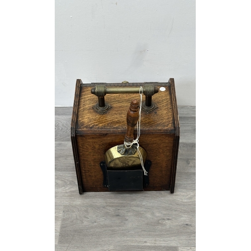 249 - A late 19th/early 20th century oak and walnut coal scuttle with brass handle and shovel - approx. 36... 