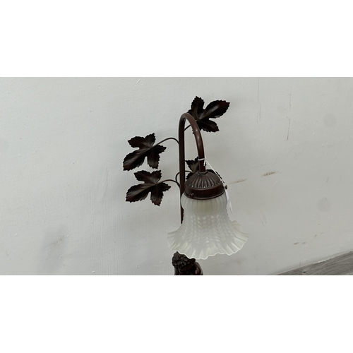 250 - An Art Nouveau style bronzed resin and metal figural table lamp with glass shade - approx. 56cm high