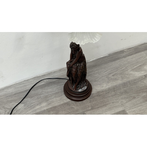 250 - An Art Nouveau style bronzed resin and metal figural table lamp with glass shade - approx. 56cm high