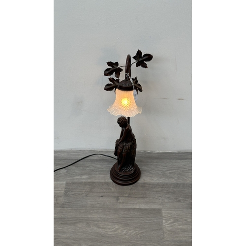 250 - An Art Nouveau style bronzed resin and metal figural table lamp with glass shade - approx. 56cm high