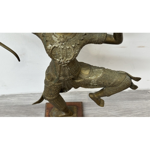 251 - A Thai bronze sculpture of Prince Rama on wooden plinth - approx. 65cm high