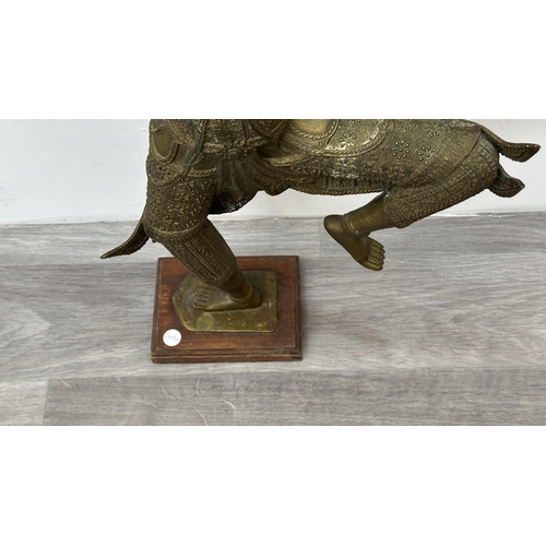 251 - A Thai bronze sculpture of Prince Rama on wooden plinth - approx. 65cm high