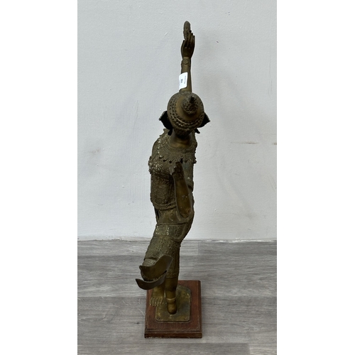 251 - A Thai bronze sculpture of Prince Rama on wooden plinth - approx. 65cm high