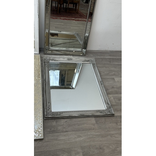 255 - Four modern framed wall mirrors, one white painted arched, one silver painted and bevelled, one Fren... 