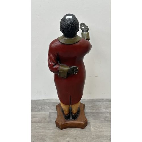 260 - A hand painted fibreglass statue of a butler - approx. 100cm high