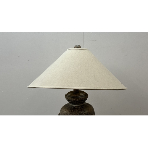 262 - A stone effect plaster urn shaped standard lamp with shade - approx. 153cm high