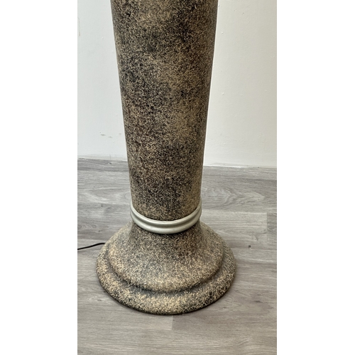 262 - A stone effect plaster urn shaped standard lamp with shade - approx. 153cm high