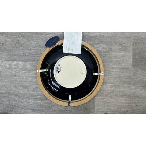 264 - A framed Moorcroft Anemone pattern circular wall plate - approx. 30cm diameter