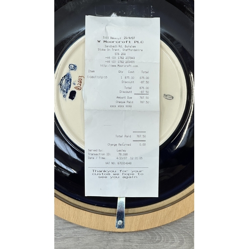 264 - A framed Moorcroft Anemone pattern circular wall plate - approx. 30cm diameter