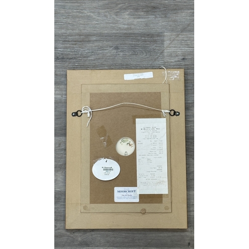 267 - A framed Moorcroft Lamia pattern wall plaque by Rachel Bishop - approx. 42cm high x 31cm wide