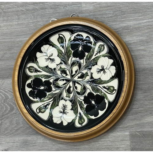 269 - A framed Moorcroft Harlequinade circular wall plate - approx. 30cm diameter