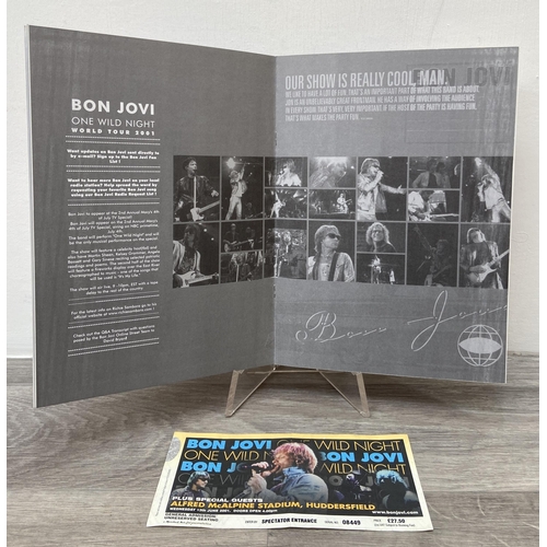 102 - Two official Bon Jovi 'One Wild Night' 2001 tour programmes, two variants, together with a ticket fo... 