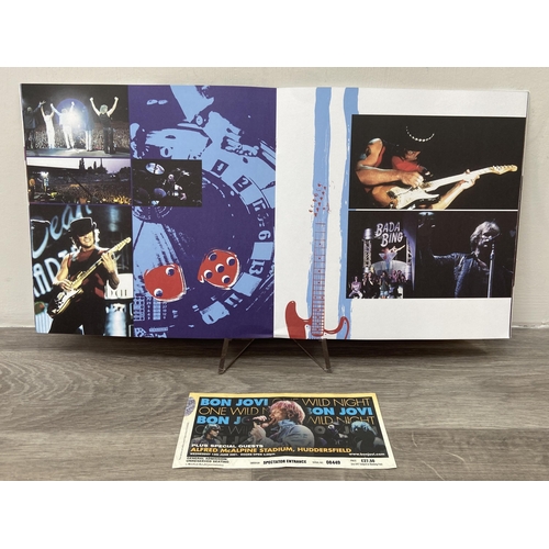 102 - Two official Bon Jovi 'One Wild Night' 2001 tour programmes, two variants, together with a ticket fo... 