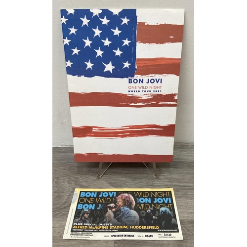 102 - Two official Bon Jovi 'One Wild Night' 2001 tour programmes, two variants, together with a ticket fo... 