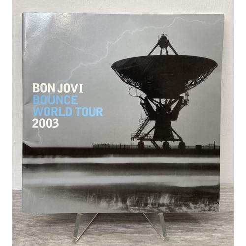 103 - An official Bon Jovi 'Bounce' 2003 UK tour programme together with two badges and a ticket for Manch... 